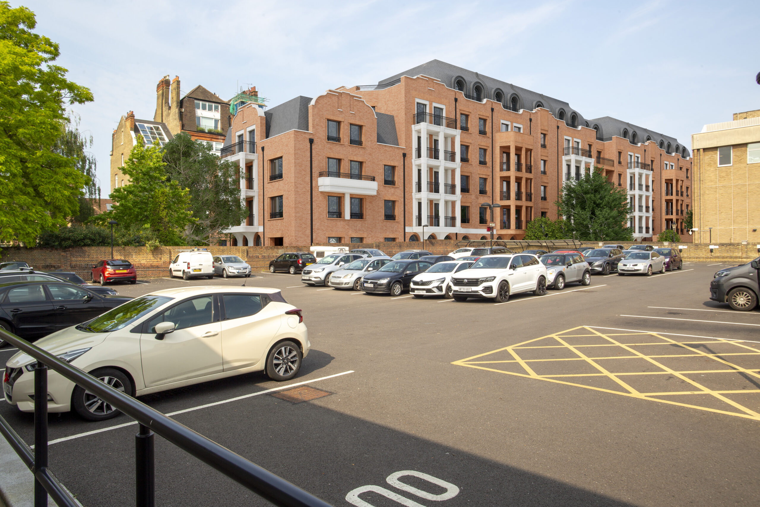 After inmage: view of an extended multi-storey block spans the scene, closing sky views and compressing the townscape.